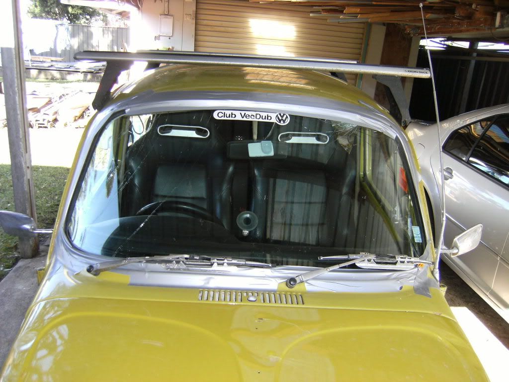 http://i1202.photobucket.com/albums/bb364/Jeff_Walsh/Rolling%20the%20bug/Mybugrolled-Windscreenducttapedinfortriphome.jpg