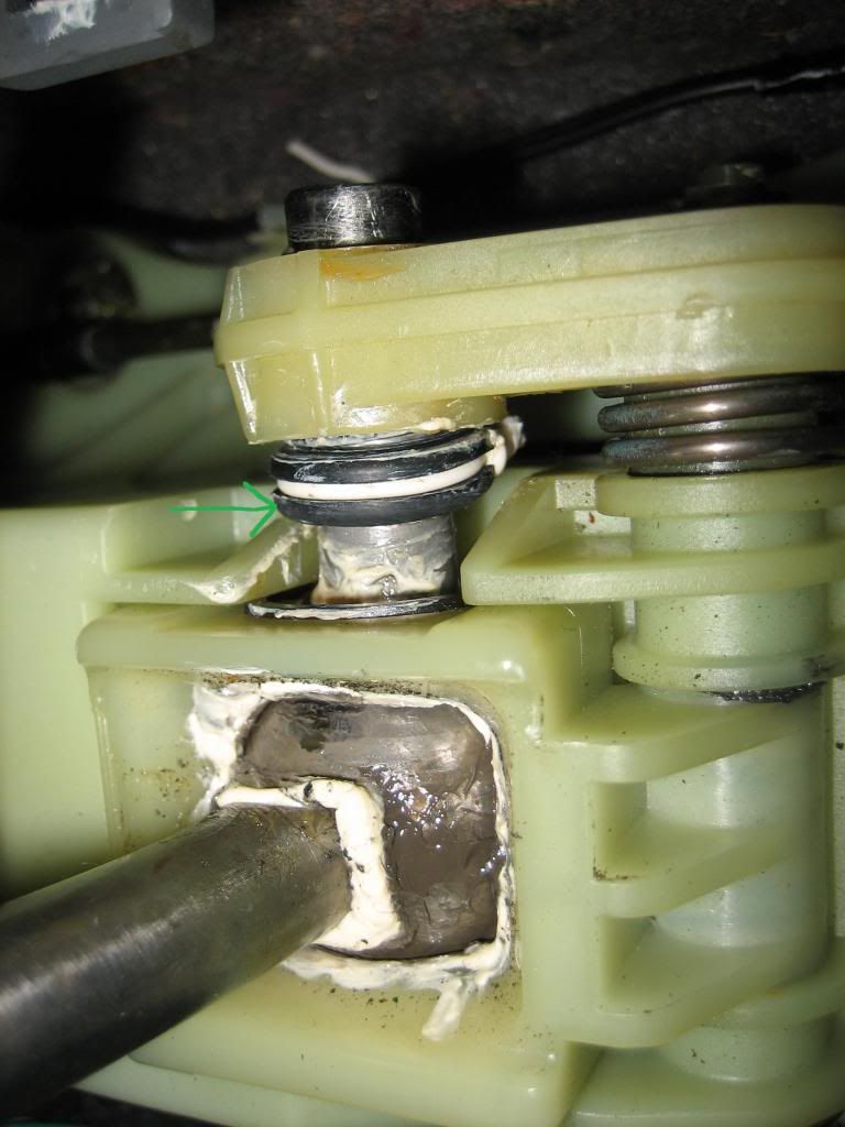 Retaining clip added to shifter linkage quiets buzz and smooths shifts